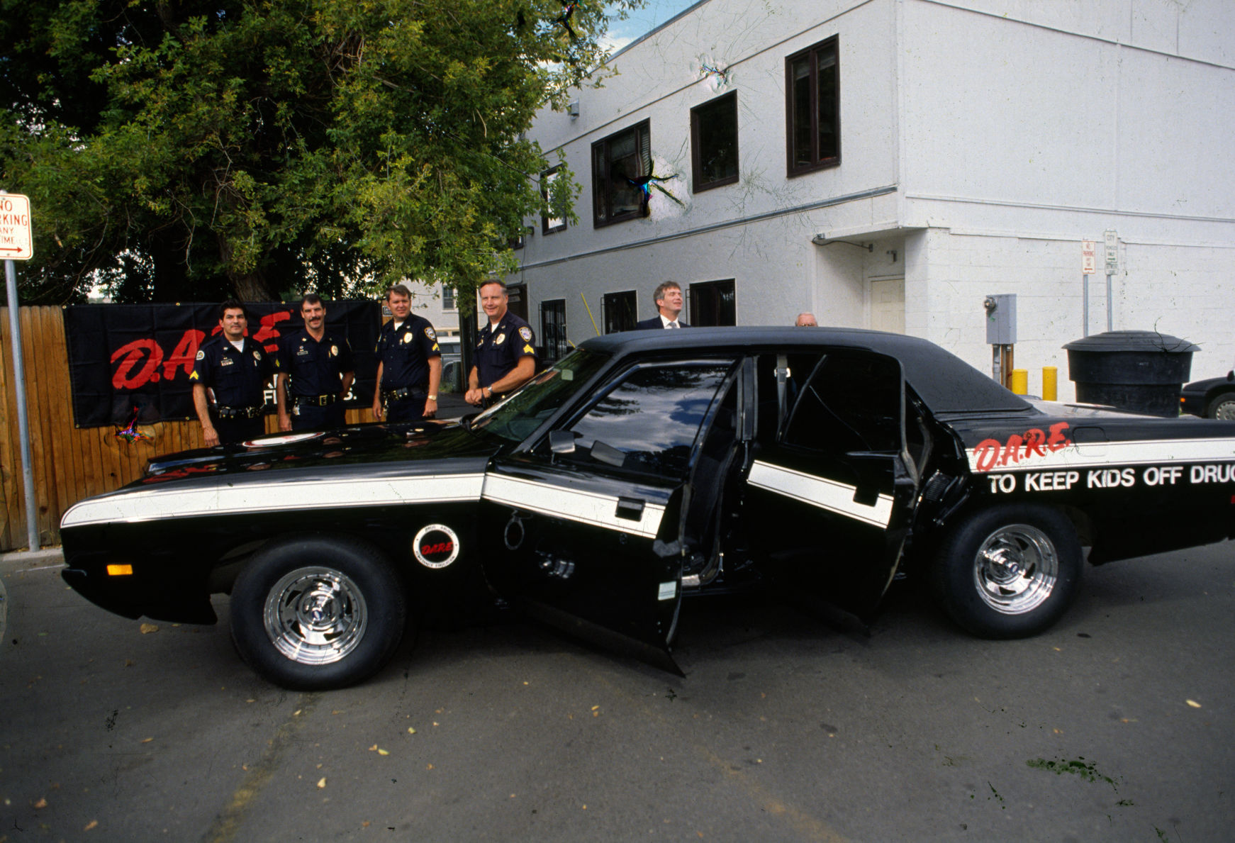 Billings police officers with D.A.R.E. car, 1990